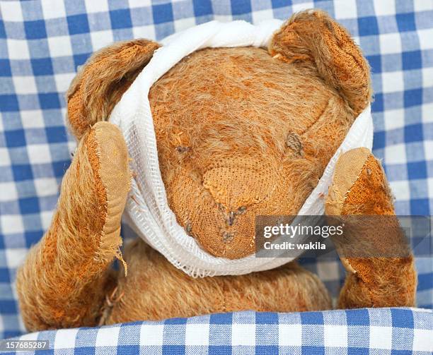 sick teddy - animal ear stock pictures, royalty-free photos & images