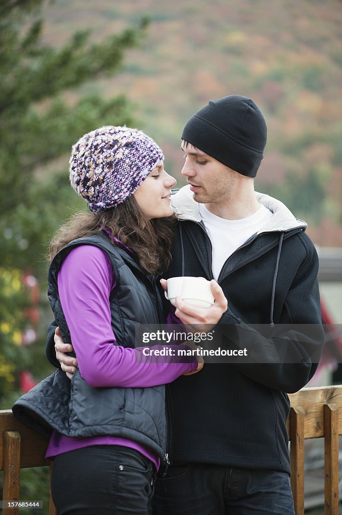 Couple hugging at the chalet.
