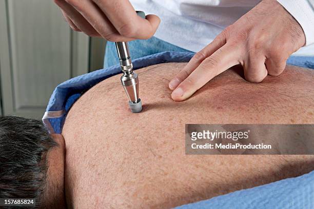 chiropractor at work - chiropractic stock pictures, royalty-free photos & images