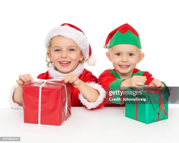 christmas santa and elf with presents - father christmas and elves stock pictures, royalty-free photos & images