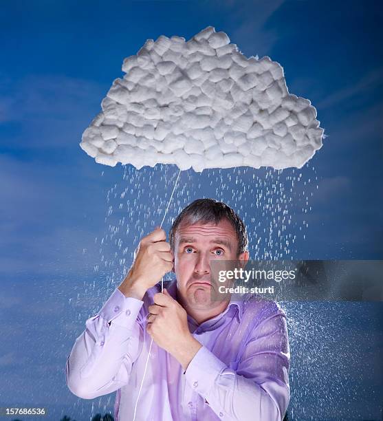 man underneath a raincloud - drenched stock pictures, royalty-free photos & images