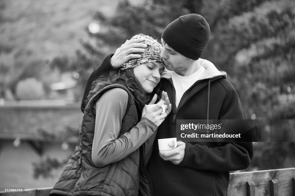 Couple hugging at the chalet.