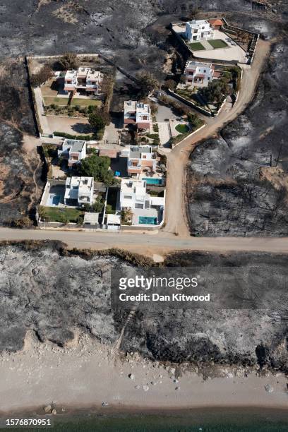 Empty beaches along a blackened coastline on July 28, 2023 in Gennadi, Rhodes, Greece. Since the wildfires that swept across the south of the island...