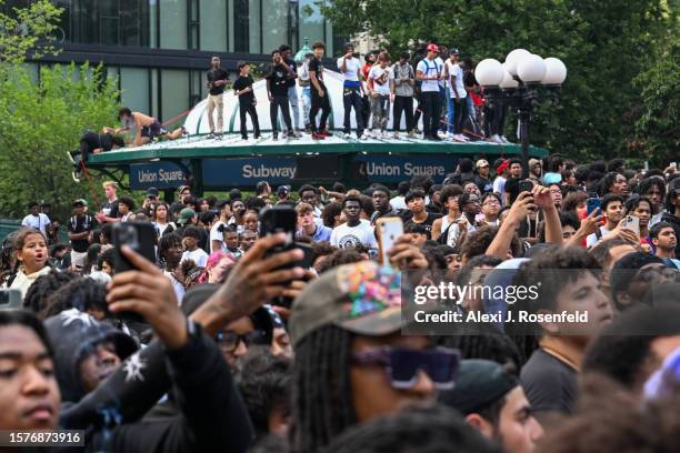 People gather for a "giveaway" event announced by popular Twitch live streamer Kai Cenat in Union Square and the surrounding area on August 4, 2023...