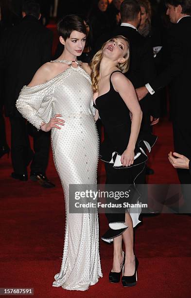 Anne Hathaway and Amanda Seyfried attend the World Premiere of 'Les Miserables' at Odeon Leicester Square on December 5, 2012 in London, England.