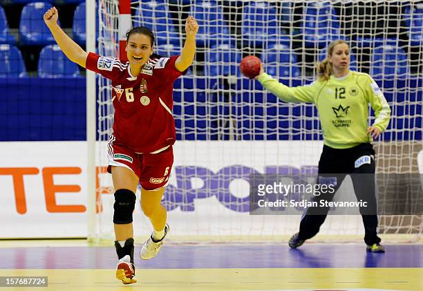 Orsolya Verten of Hungary celebrates the goal near Katja Schulke during the Women's European Handball Championship 2012 Group C match between Hungary...