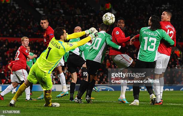 Mario Felgueiras of CFR 1907 Cluj punches clear under pressure during the UEFA Champions League Group H match between Manchester United and CFR 1907...