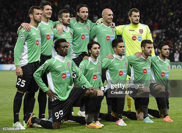 The CFR Cluj-Napoca team line up before the UEFA Champions League group H football match between Manchester United and CFR Cluj-Napoca at Old...