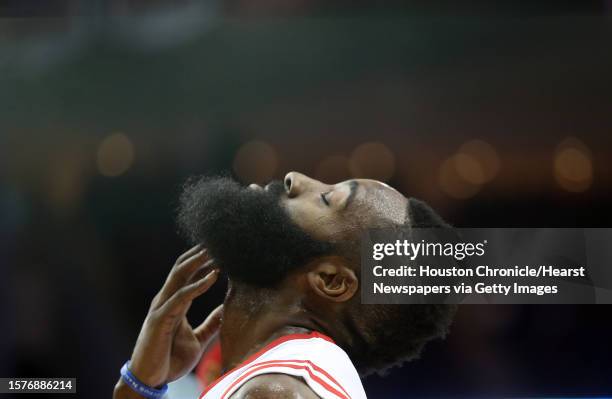 Houston Rockets guard James Harden is struck on the chin by Brooklyn Nets guard Alan Anderson in the second half of the basketball game at the Toyota...