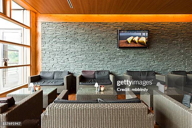 luxury hotel lobby with tables, sofas and lcd tv - lobby screen stock pictures, royalty-free photos & images