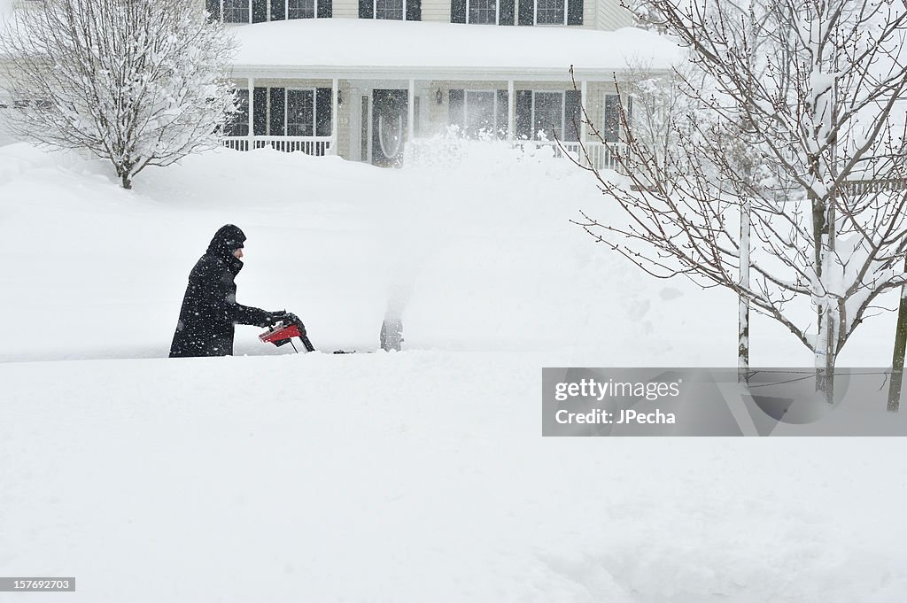 Blizzard Snow, Man using Snowblower