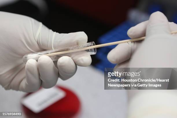 Microbiologist Juanita Sumpter tests for Salmonella in the microbiology lab at the Houston Health and Human Services Department on Thursday, June 18...