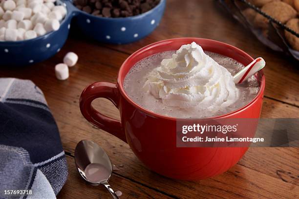 mug of steamy hot chocolate and whipped cream - whipped cream stock pictures, royalty-free photos & images