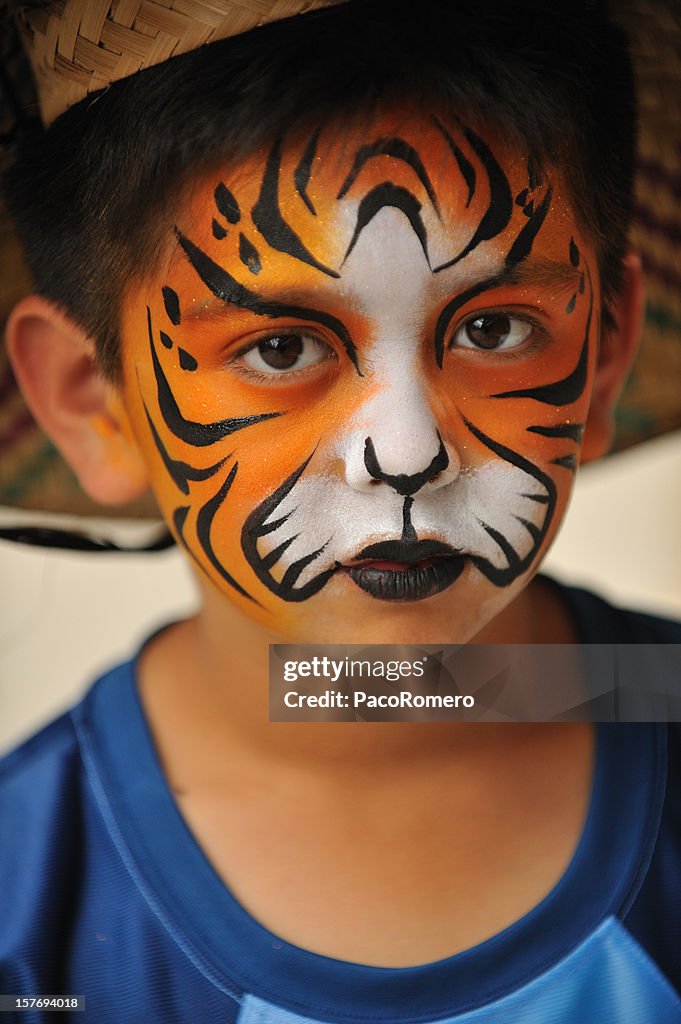 Little Boy With Tiger Mask Painted On His Face High-Res Stock Photo - Getty  Images