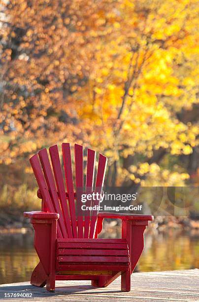 adirondack chair in fall - muskoka stock pictures, royalty-free photos & images