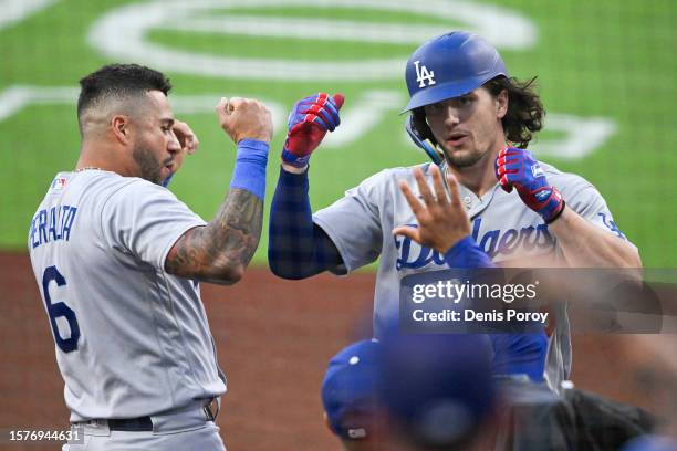 James Outman of the Los Angeles Dodgers is congratulated by David Peralta after hitting a solo home run during the second inning of a baseball game...