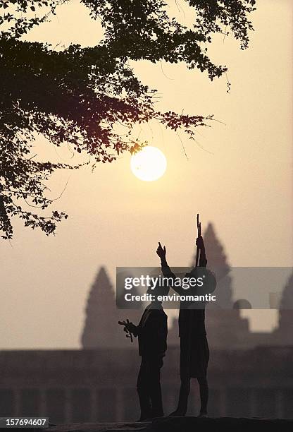 children looking for tamarinds at angkor wat. - tamarind bildbanksfoton och bilder