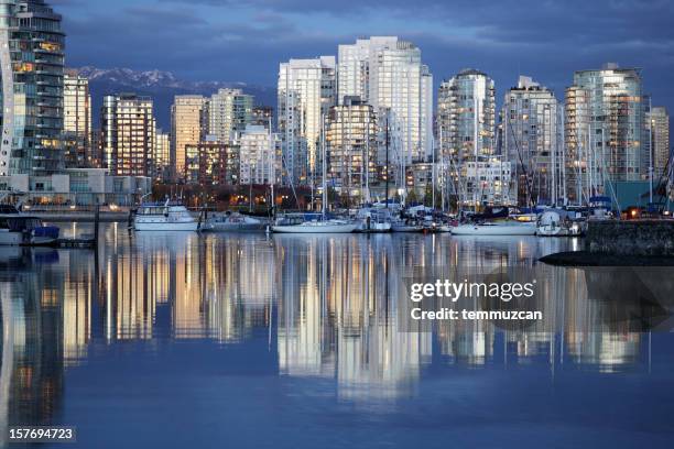 vancouver city skyline reflected in river at night - yaletown stock pictures, royalty-free photos & images