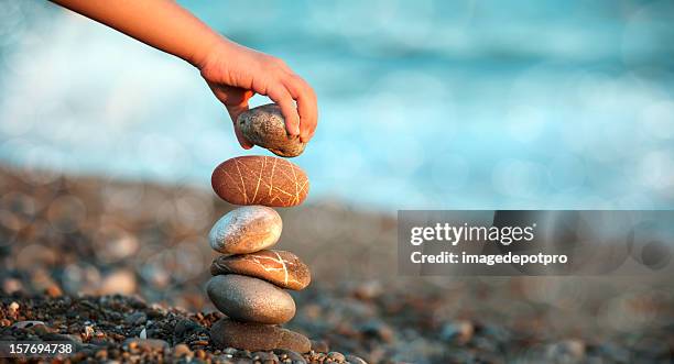 child playing on beach - aspirational stockfoto's en -beelden