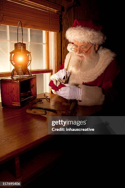 pictures of real santa claus working in his shop - santas workshop stock pictures, royalty-free photos & images