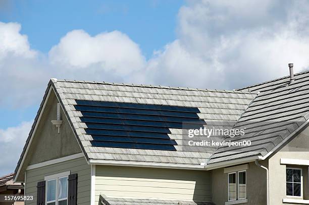 solar panels on roof - roof tiles stock pictures, royalty-free photos & images