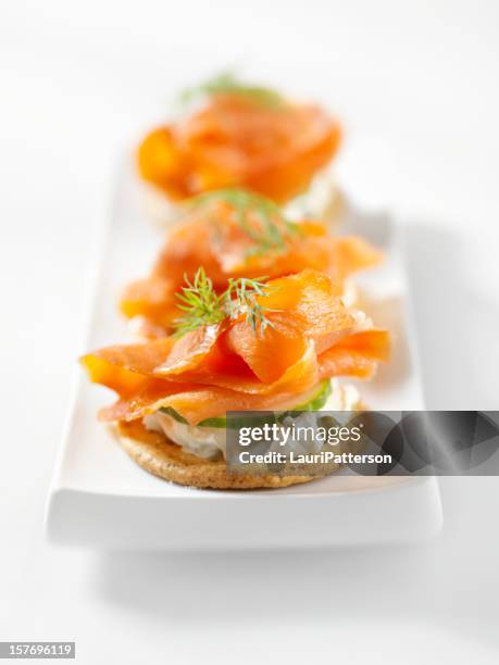 smoked salmon canapes with cream cheese - canape stock pictures, royalty-free photos & images