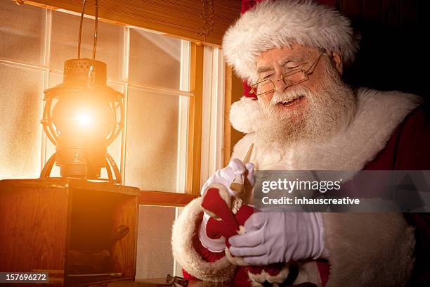 pictures of real santa claus working in his shop - santas workshop stock pictures, royalty-free photos & images