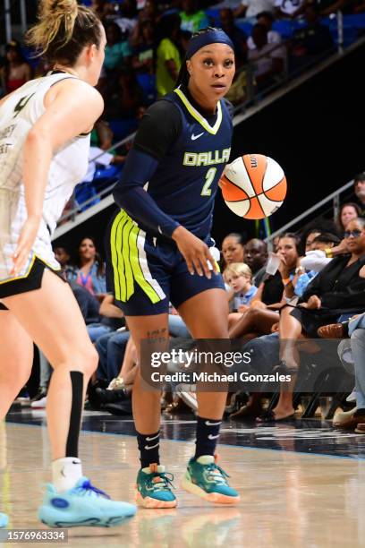 Odyssey Sims of the Dallas Wings dribbles the ball during the game against the Chicago Sky on August 4, 2023 at the College Park Center in Arlington,...