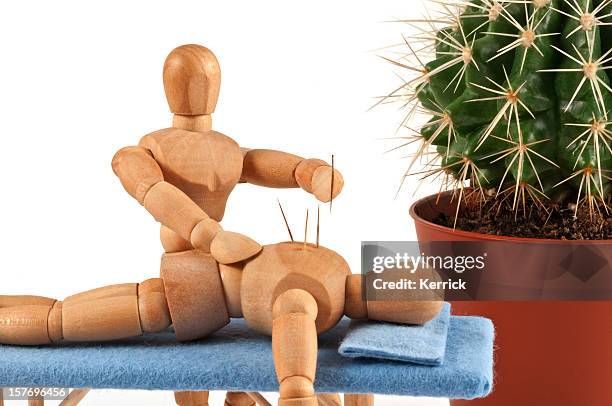 acupuncture - wooden mannequin with special needles - acupuncture model stock pictures, royalty-free photos & images