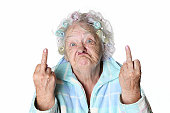 Senior Humor: cranky woman making faces and flipping the bird.