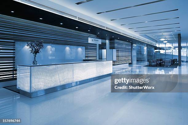 commercial building lobby reception - hospital reception stock pictures, royalty-free photos & images