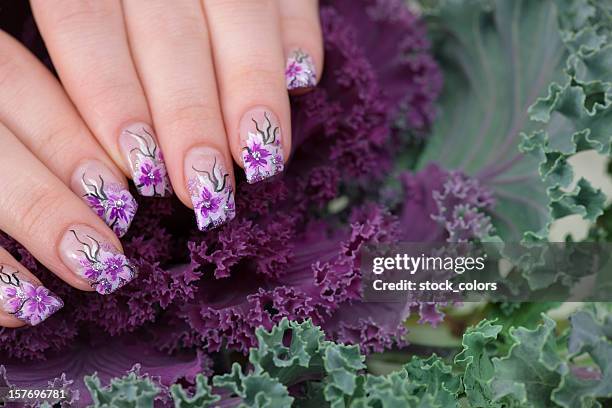 manicure posed on a plant - violet nails stock pictures, royalty-free photos & images