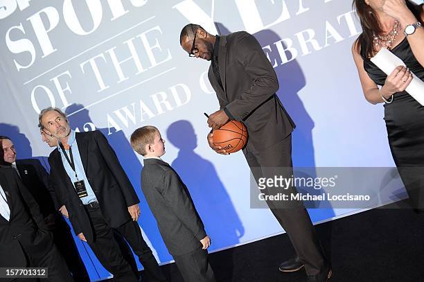 Sportskid Conner Long and 2012 Sportsman of the Year LeBron James attend the 2012 Sports Illustrated Sportsman of the Year award presentation at...