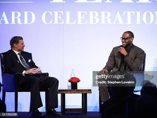 Sportscaster Dan Patrick and 2012 Sportsman of the Year LeBron James speak onstage at the 2012 Sports Illustrated Sportsman of the Year award...