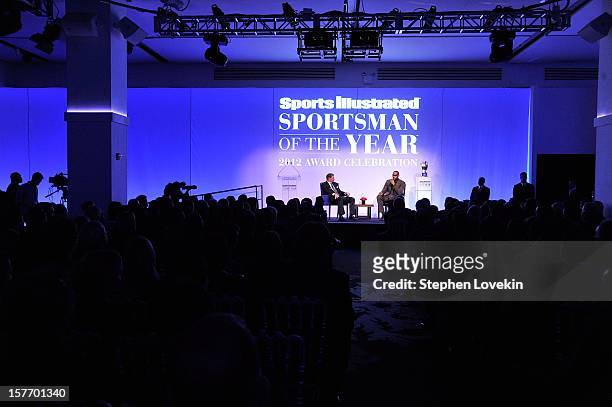 Sportscaster Dan Patrick and 2012 Sportsman of the Year LeBron James speak onstage at the 2012 Sports Illustrated Sportsman of the Year award...