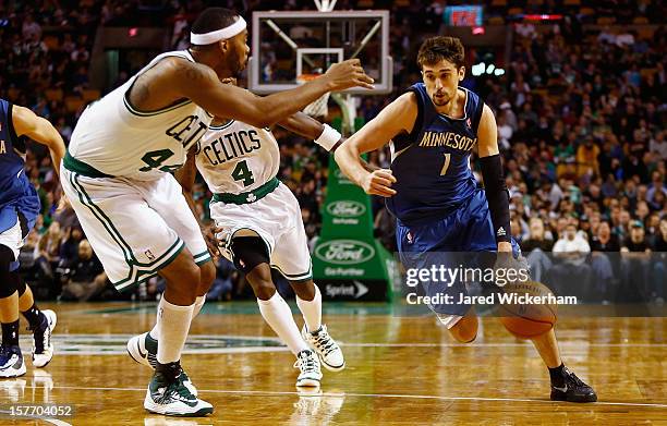 Alexey Shved of the Minnesota Timberwolves drives to the basket in front of Chris Wilcox of the Boston Celtics during the game on December 5, 2012 at...