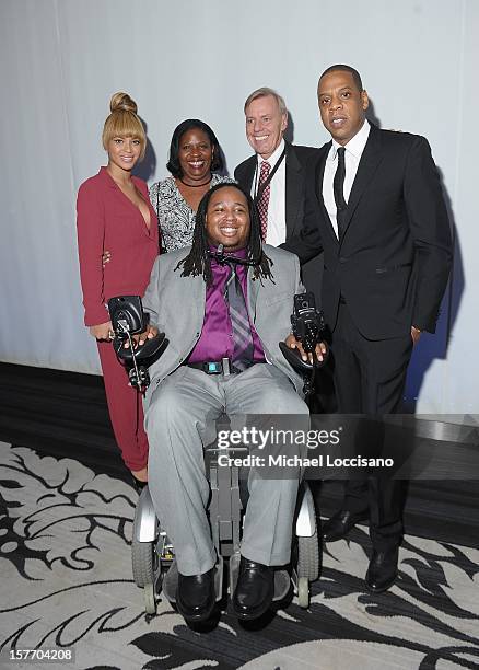 Beyonce, Former professional football player Eric LeGrand and Jay-Z attend the 2012 Sports Illustrated Sportsman of the Year award presentation at...