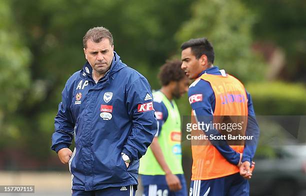Ange Postecoglou the coach of the Victory and Marcos Flores of the Victory look on during a Melbourne Victory A-League training session at Gosch's...