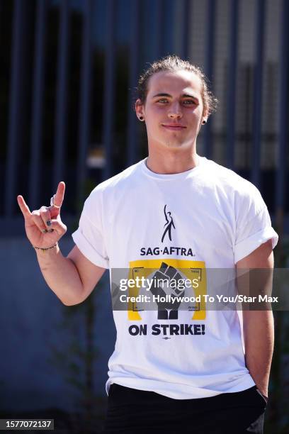 Tanner Buchanan walks the picket line in support of the SAG-AFTRA and WGA strike on August 4, 2023 in Los Angeles, California.