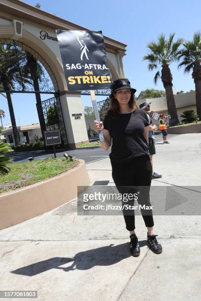 Jeanne Tripplehorn walks the picket line in support of the SAG-AFTRA and WGA strike outside the Universal Studios on August 4, 2023 in Los Angeles,...