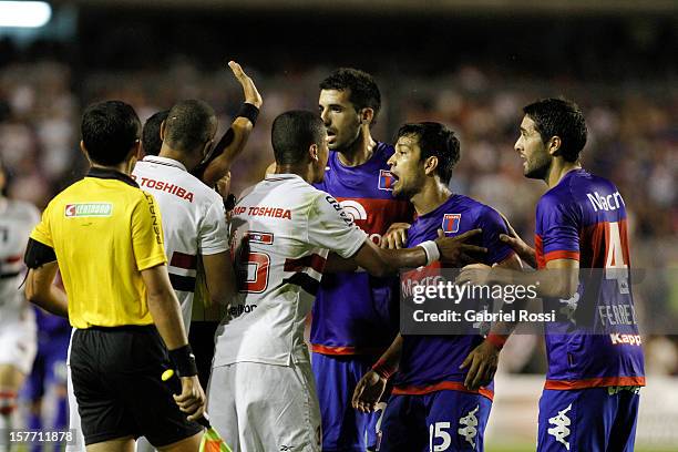 Players of Tigre protest during a match between Tigre from Argentina and Sao Paulo from Brazil as part of Bridgestone Sudamericana Cup 2012 at the...