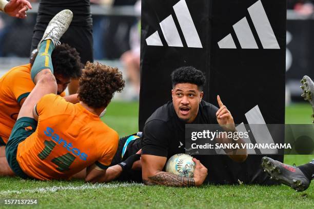 New Zealand's Leicester Fainga'anuku celebrates after scoring a try during the Rugby Championship & Bledisloe Cup Test match between Australia and...