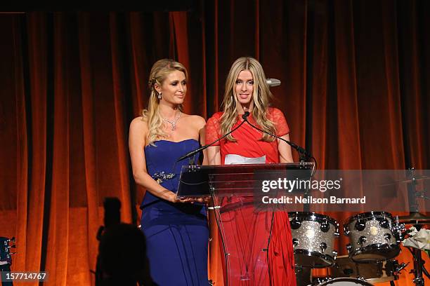 Paris Hilton and Nicky Hilton speak during the European School Of Economics Foundation Vision And Reality Awards on December 5, 2012 in New York City.