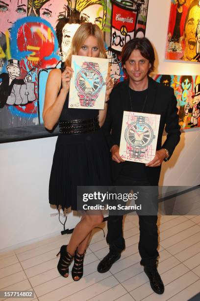 Model Karolina Kurkova and Jonathan Cheban attend the Haute Living and Roger Dubuis dinner hosted by Daphne Guinness at Azur on December 5, 2012 in...