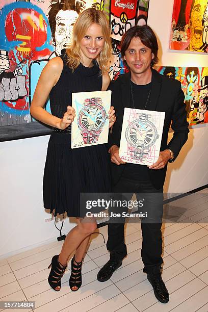 Model Karolina Kurkova and Jonathan Cheban attend the Haute Living and Roger Dubuis dinner hosted by Daphne Guinness at Azur on December 5, 2012 in...