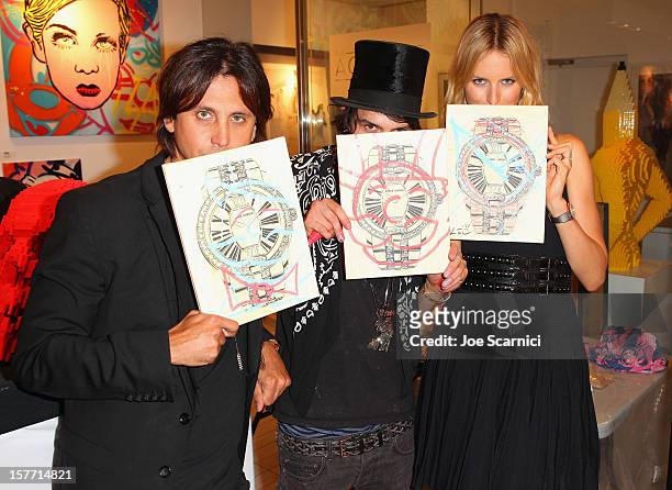 Jonathan Cheban, artist Alec Monopoly and model Karolina Kurkova attend the Haute Living and Roger Dubuis dinner hosted by Daphne Guinness at Azur on...