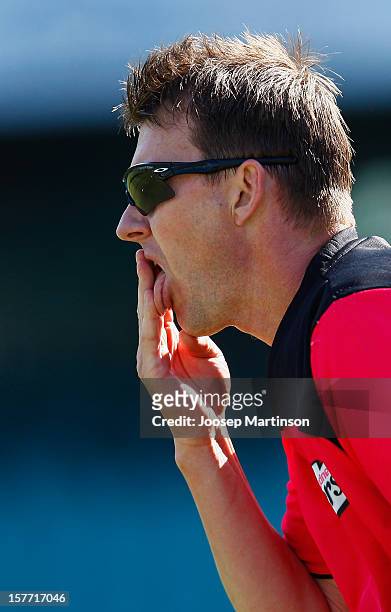 Brett Lee licks his fingertips during a Sydney Sixers training session at Sydney Cricket Ground on December 6, 2012 in Sydney, Australia.