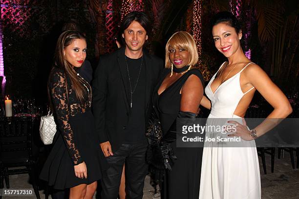 Jonathan Cheban and Violet Camacho attends the Haute Living and Roger Dubuis dinner hosted by Daphne Guinness at Azur on December 5, 2012 in Miami...
