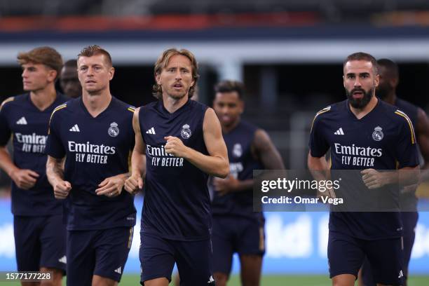 Luka Modric of Real Madrid and his teammates warm up during a training session ahead of the Pre-Season Friendly match between Real Madrid and...