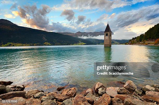 reschensee - lake reschen - tirol stock pictures, royalty-free photos & images